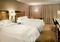 Marriott St. Louis Airport - The standard room includes a refrigerator, flat screen TV, and luxurious bedding.