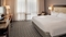 Marriott St. Louis Airport - The standard room includes a refrigerator, flat screen TV, and luxurious bedding.