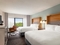 Holiday Inn Orlando International Airport - The standard room with 2 queen beds includes complimentary WiFi and a mini fridge.