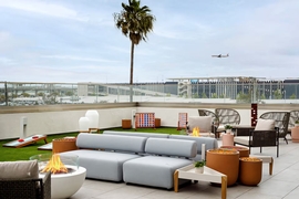 Hilton Garden Inn LAX Los Angeles Airport - Enjoy a game yard game or sit by the fire in the hotel's outdoor space.