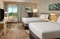 Hilton Garden Inn Orlando Airport - The standard room with 2 queen beds includes complimentary WiFi. 
