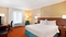 Fairfield Inn Midway Airport - The standard room with one king bed includes complimentary WiFi and a mini refrigerator. 