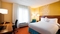 Fairfield Inn Midway Airport - The standard room with one queen bed includes complimentary WiFi and a mini refrigerator. 