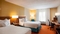 Fairfield Inn Midway Airport - The standard room with two double beds includes complimentary WiFi and a mini refrigerator. 