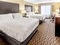 Holiday Inn Hotel & Suites Milwaukee Airport - The standard room with 2 queen beds includes complimentary WiFi. 