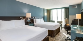 Crowne Plaza Chicago O'Hare - The standard room with two queen beds includes a flat screen TV, desk, and a sleeper sofa.