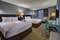 Crowne Plaza Chicago Ohare - The standard room with two queen beds includes a flat screen TV, desk, and a sleeper sofa.