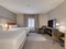 Candlewood Suites Milwaukee Airport-Oak Creek - The standard queen room includes a TV, microwave, refrigerator, and free WIFI.