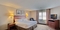 Candlewood Suites Milwaukee Airport-Oak Creek - The standard queen bed includes a TV, microwave, refrigerator, and free WIFI. 