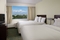 SpringHill Suites Ft. Lauderdale Airport and Cruise Port - The standard room with 2 queen beds has a separate living room with a sleeper sofa, a microwave, and refrigerator.