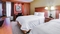 Hampton Inn Pittsburgh Airport - The standard room with two queen size beds includes free WiFi, a desk, and coffee maker.