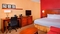 Courtyard Orlando Airport - The standard room with one king bed includes complimentary WiFi. 