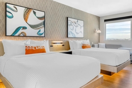 Cambria Hotel Burbank Airport - The standard room with two queen beds includes complimentary WiFi and a mini refrigerator. 