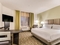 Candlewood Suites Portland Airport - The standard guest room includes either a king, queen, or two queen beds. 