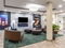 Candlewood Suites Portland Airport - Relax with travel companions in the hotel lobby.