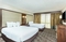 Embassy Suites Nashville Airport - The standard room with 2 double beds has a separate living room with a sleeper sofa, TV, a microwave, and refrigerator.